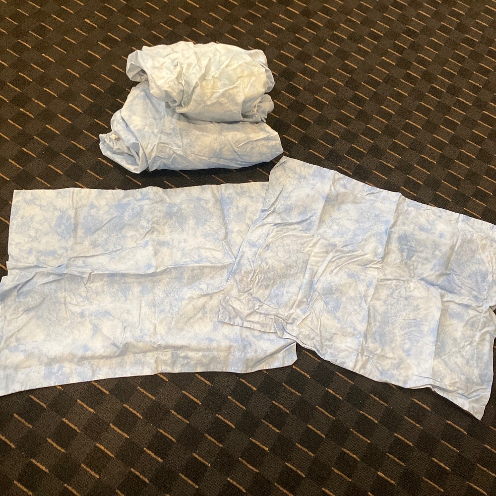 Two twin XL sheets, and two matching pillow shams